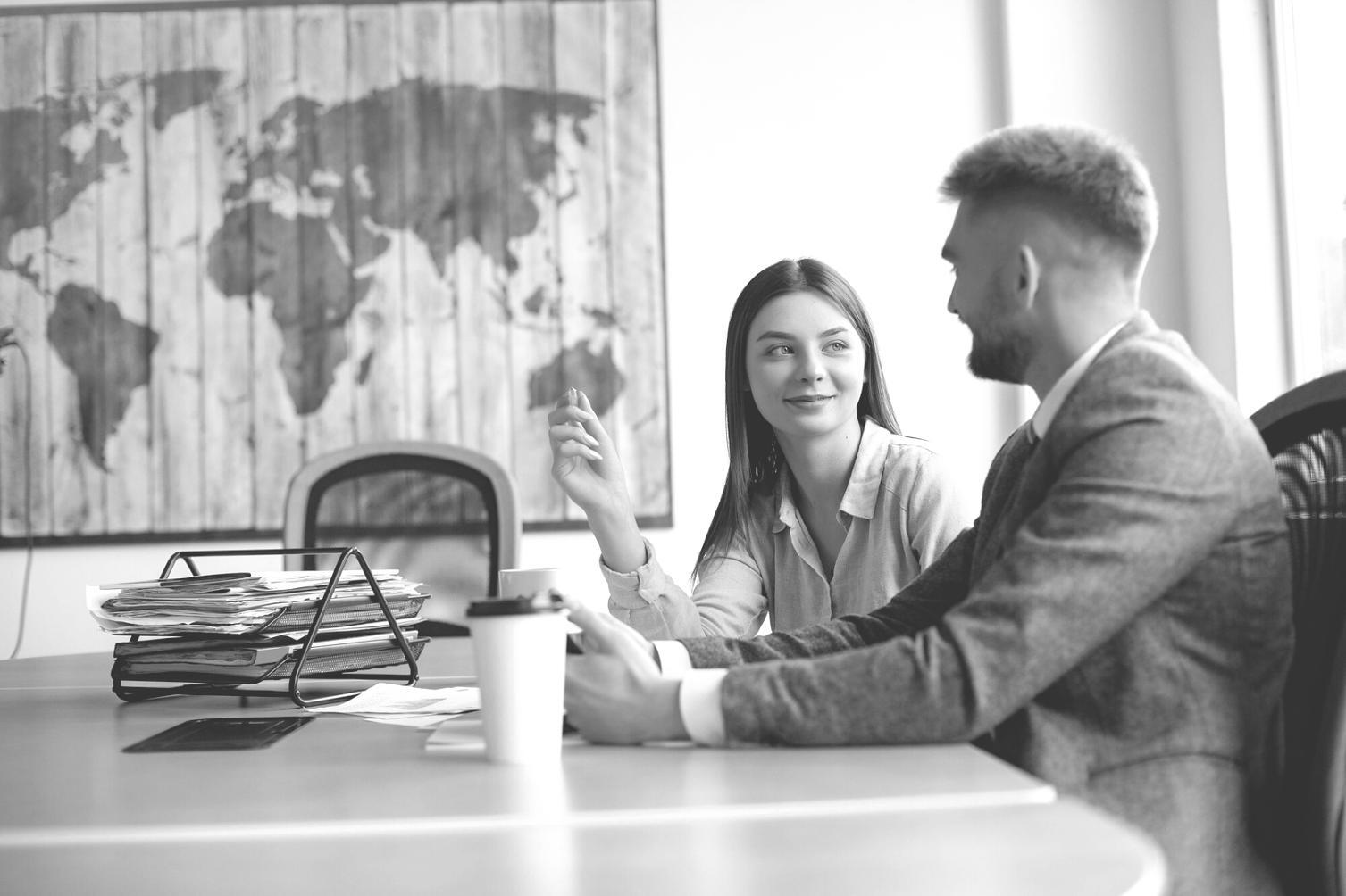EliteFuturon office workspace in Taichung showing team collaboration on financial data integration systems