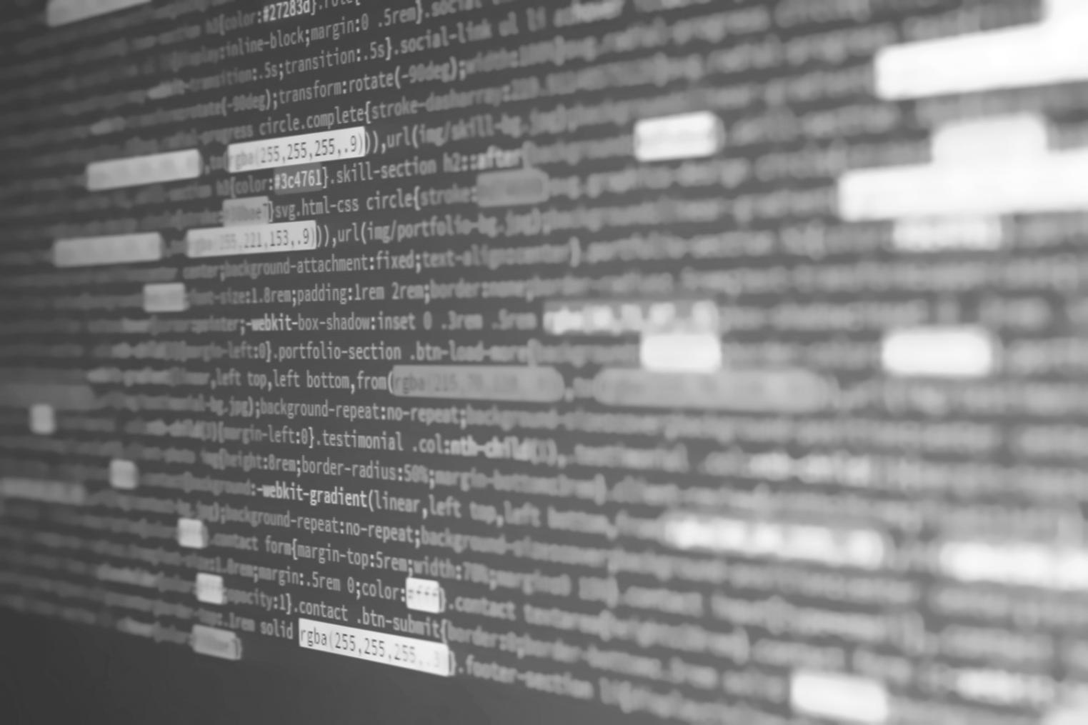 Team reviewing financial data synchronization process with multiple screens showing real-time integration